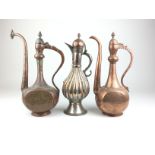 Three 19th Century Islamic tinned copper Ewers, comprising a tinned copper ewer with lobed body,