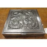 A Persian silver square Box with hinged cover finely embossed and chased with exotic birds amongst