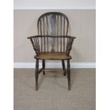A 19th Century Windsor Elbow Chair with pierced splat and stick back, solid seat on turned leg and H