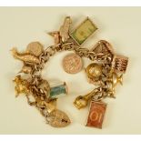 A 9ct gold curb-link Bracelet with numerous Charms, approx 60gms all in