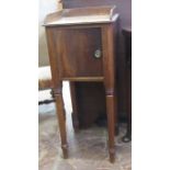 A late Georgian mahogany Pot Cupboard on turned tapering legs, 14in