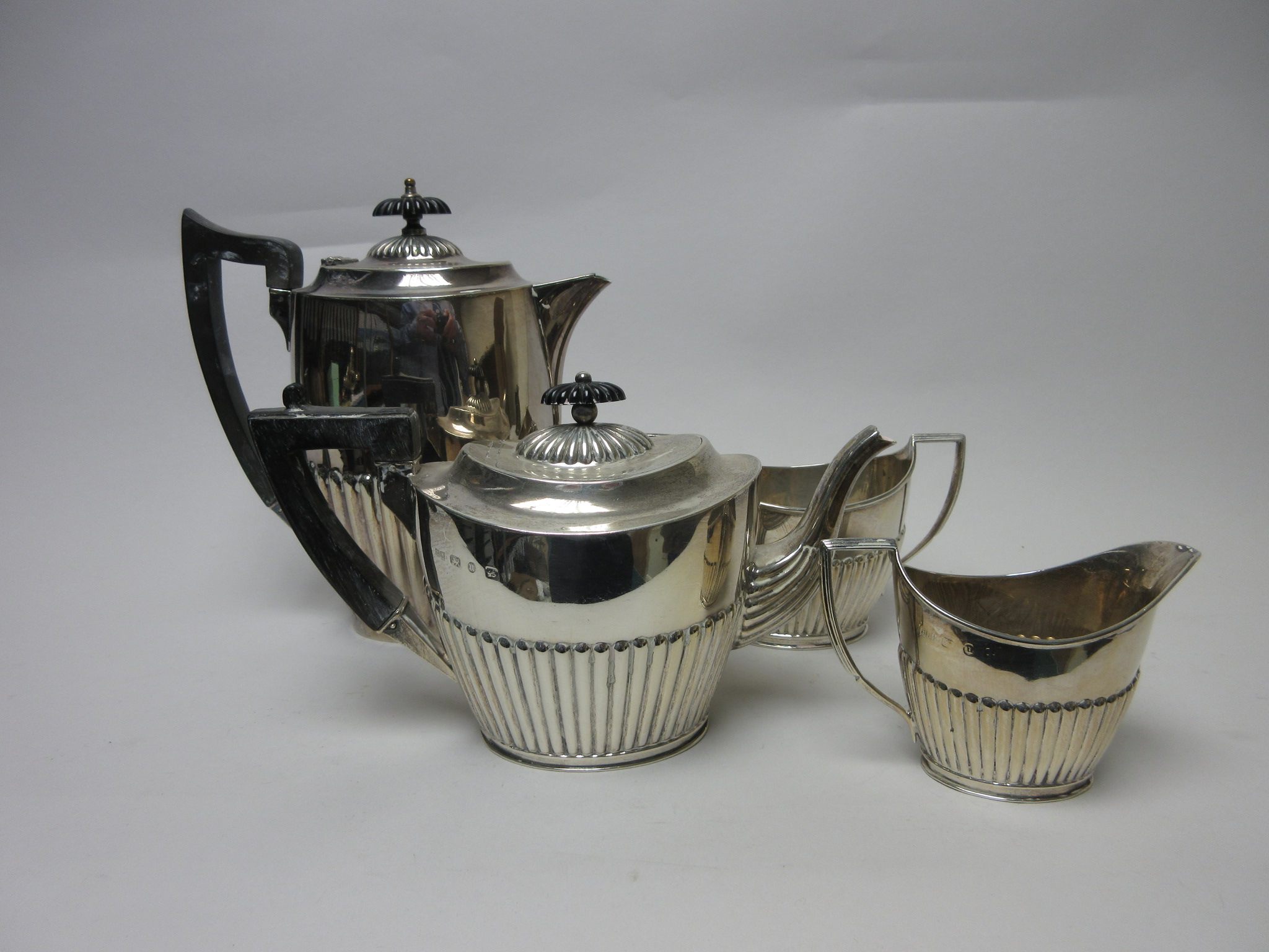 A Victorian silver three piece Tea Service of oval semi-fluted form, Birmingham 1894 and a