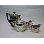 A Victorian silver three piece Tea Service of oval semi-fluted form, Birmingham 1894 and a