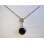 A Sapphire and Diamond Necklace millegrain-set round sapphire, 3.80cts, suspended below two old-