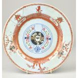 A Chinese rouge de fer and famille rose armorial Plate, probably for the Dutch market, Yongzheng,