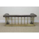 A brass Club Fender with leather upholstery above vertical brass bars and stepped brass base, 4ft
