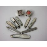 Two small silver Stamp Cases on ball feet, Birmingham 1899 and 1906 and eight Fruit Knives