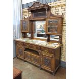 A late 19th Century walnut Aesthetic movement Sideboard with raised mirror back fitted pair of small