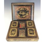 An early 19th Century Chinese black and gold lacquer Games Box,The cover and sides decorated with