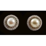 A pair of Cultured Pearl and Diamond Earrings each set single pearl, total pearl weight 8.72cts,