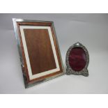An Edward VII oval silver Photograph Frame, Birmingham 1901, and a large rectangular Frame with