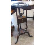 A Georgian mahogany Wig Powdering Stand fitted two small drawers on three splayed legs