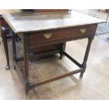 An 18th Century oak Side Table, the moulded top above a frieze drawer on turned legs united by