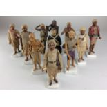 A group of 20th Century Indian pottery Figurines,Each figure on square base, some titled in