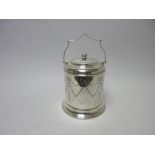 A George V silver Biscuit Barrel and Cover with ribbon and swag engraving and swing handle,