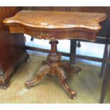 A mid Victorian burr walnut serpentine Card Table with shaped fold over top laid with circular green