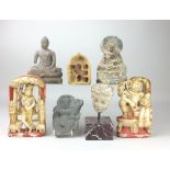 A collection of fragmentary Indian stone Carvings,including a Gandhara Buddha and two Rajasthan