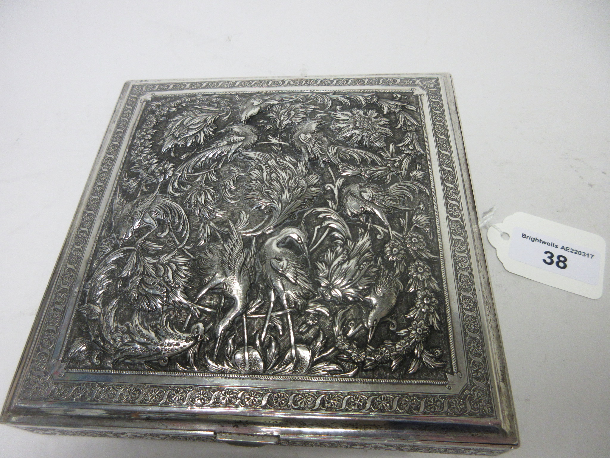 A Persian silver square Box with hinged cover finely embossed and chased with exotic birds amongst - Image 3 of 6