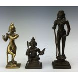 Three Indian bronze and brass Figures of Krishna, Arjuna and Skanda, 18th/19th Century, Krishna