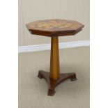 A 19th Century octagonal specimen wood Table with star design on tapering octagonal column and