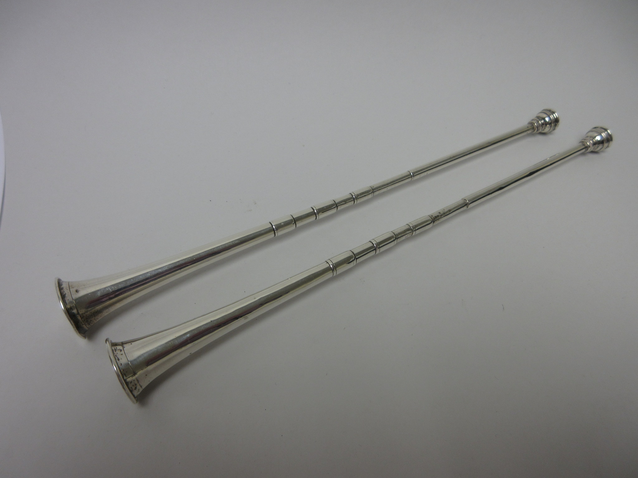 A pair of Edward VII silver Candle Snuffers in the form of hunting horns, London 1903, 12in