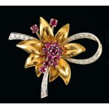 A Ruby and Diamond Flower Spray Brooch claw-set twelve round rubies and pavé-set brilliant-cut