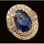 A Sapphire and Diamond Cocktail Ring claw-set pear-cut sapphire, 7.45cts, within double frame of