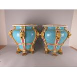 An impressive pair of Majolica Jardinieres with moulded top rim, with six lion mask and ring handles