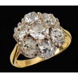 A Diamond Cluster Ring claw-set seven old-cut stones, estimated total weight 2.50cts, stamped 18K,