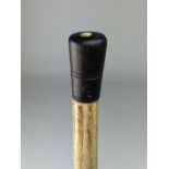 A 19th Century whalebone Walking Cane,The faceted shaft topped with turned horn or baleen handle,