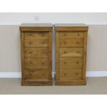 A pair of 19th Century walnut Wellington Chests of five graduated drawers on plinth bases, 3ft 6in H