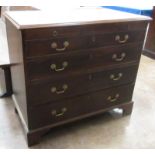 A George III mahogany Bachelor's Chest of Drawers, the cross-banded top above a brushing slide and