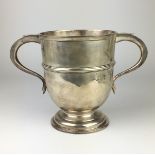 An Edward VII silver two-handled Trophy Cup of U-form with lateral band, socle foot, London 1904,