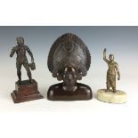 Three Asian metal Figures,Comprising a Burmese bronze figure of a tattooed water carrier on plinth