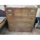 A 19th Century teak Military Secretaire Chest brass bound and in two sections having central