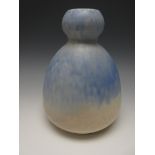 A Ruskin pottery gourd shaped baluster Vase with mottled blue and cream decoration, impressed