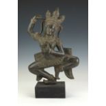 A 20th Century Khmer style bronze figure of an Aspara, Cambodia,Modelled in a dancing pose, wood