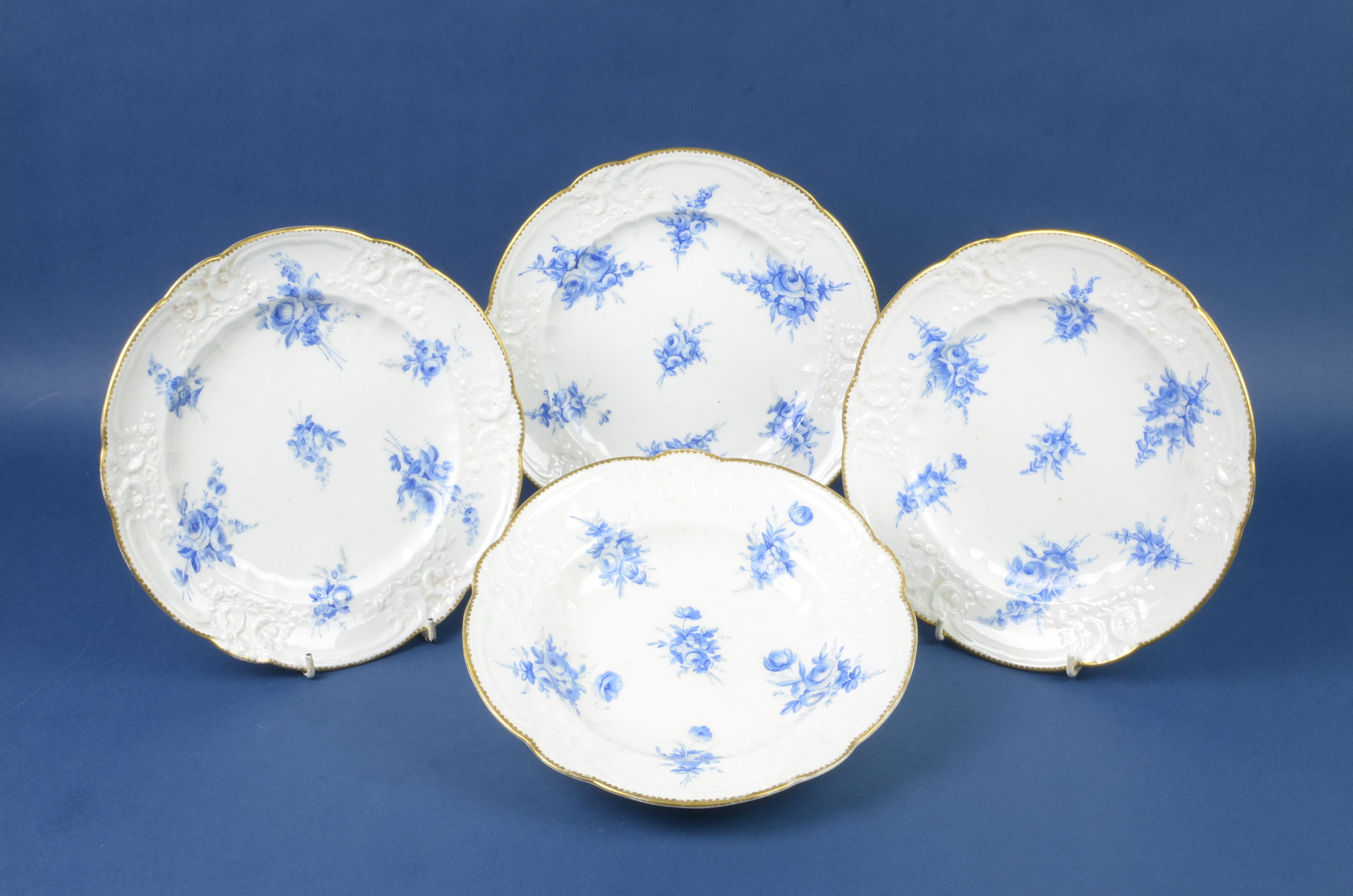 Four Nantgarw porcelain Plates, circa 1818-1820, comprising three dinner plates and a soup plate,