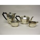 A George VI silver four piece Tea Service of panelled form engraved initial W, Sheffield 1942,