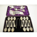 One dozen silver Teaspoons and Sugar Tongs with finely engraved stems, London 1879, in case, six