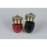 Two Vinaigrettes in ruby and green faceted glass having floral and leafage scroll engraved lids