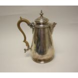 An Edward VII Coffee Pot of pear shape with scroll handle, London 1901, Walker and Hall