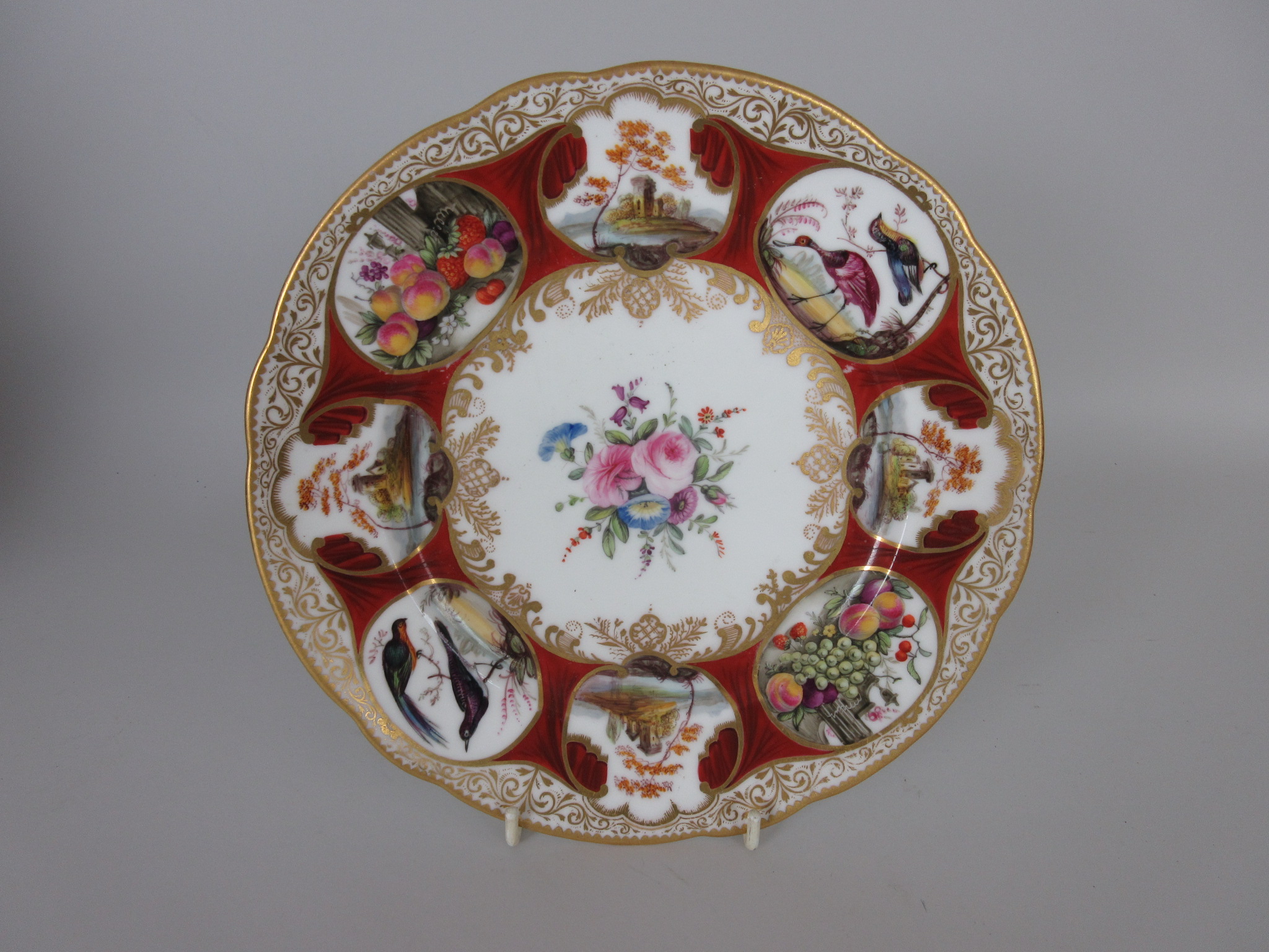 A Nantgarw porcelain Plate of Duke of Cambridge Service type, central bouquet of flowers with