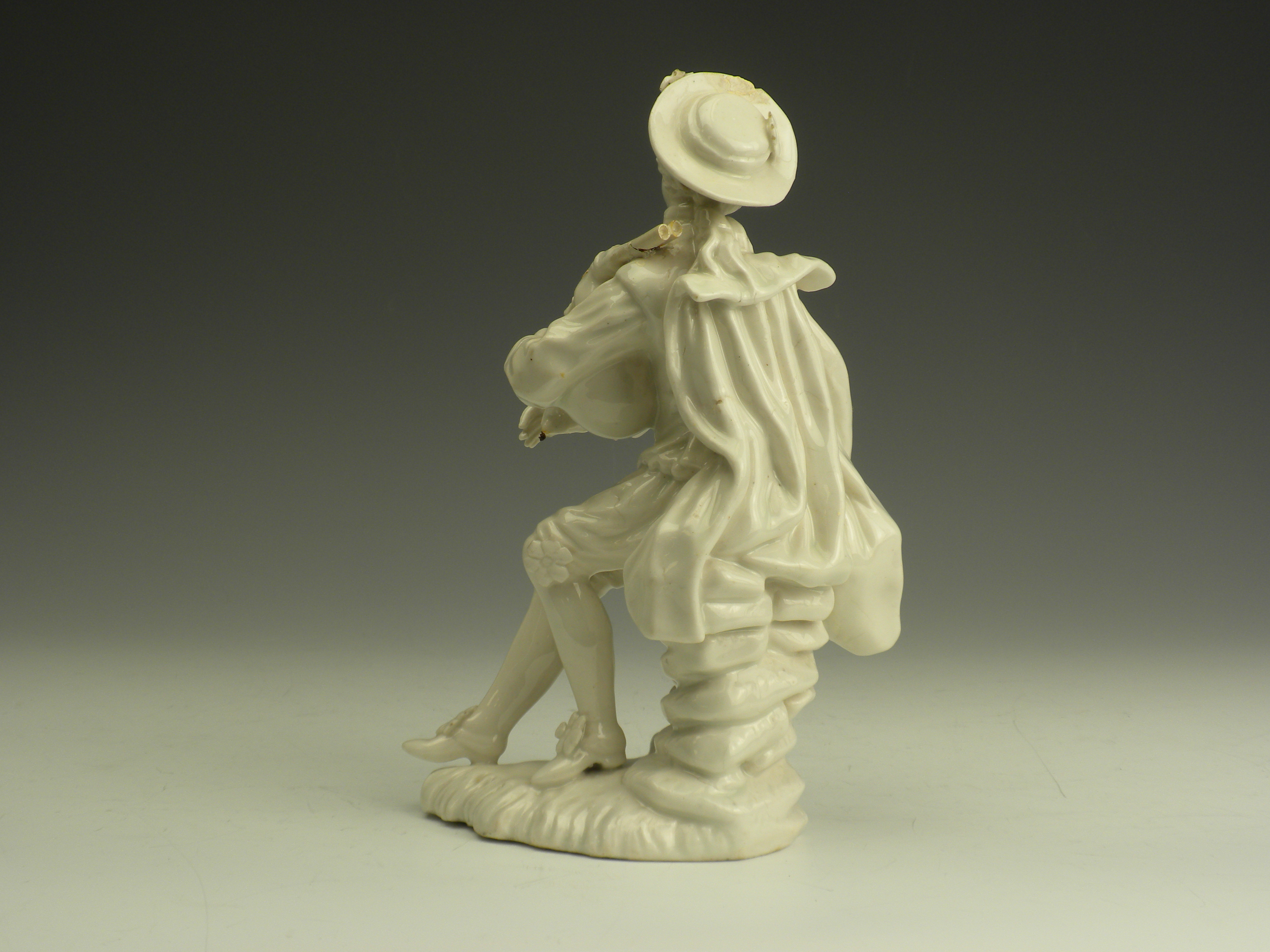 An 18th Century English porcelain Figure, c.1780, of a seated bagpiper, 7in high (repairs) - Image 3 of 9