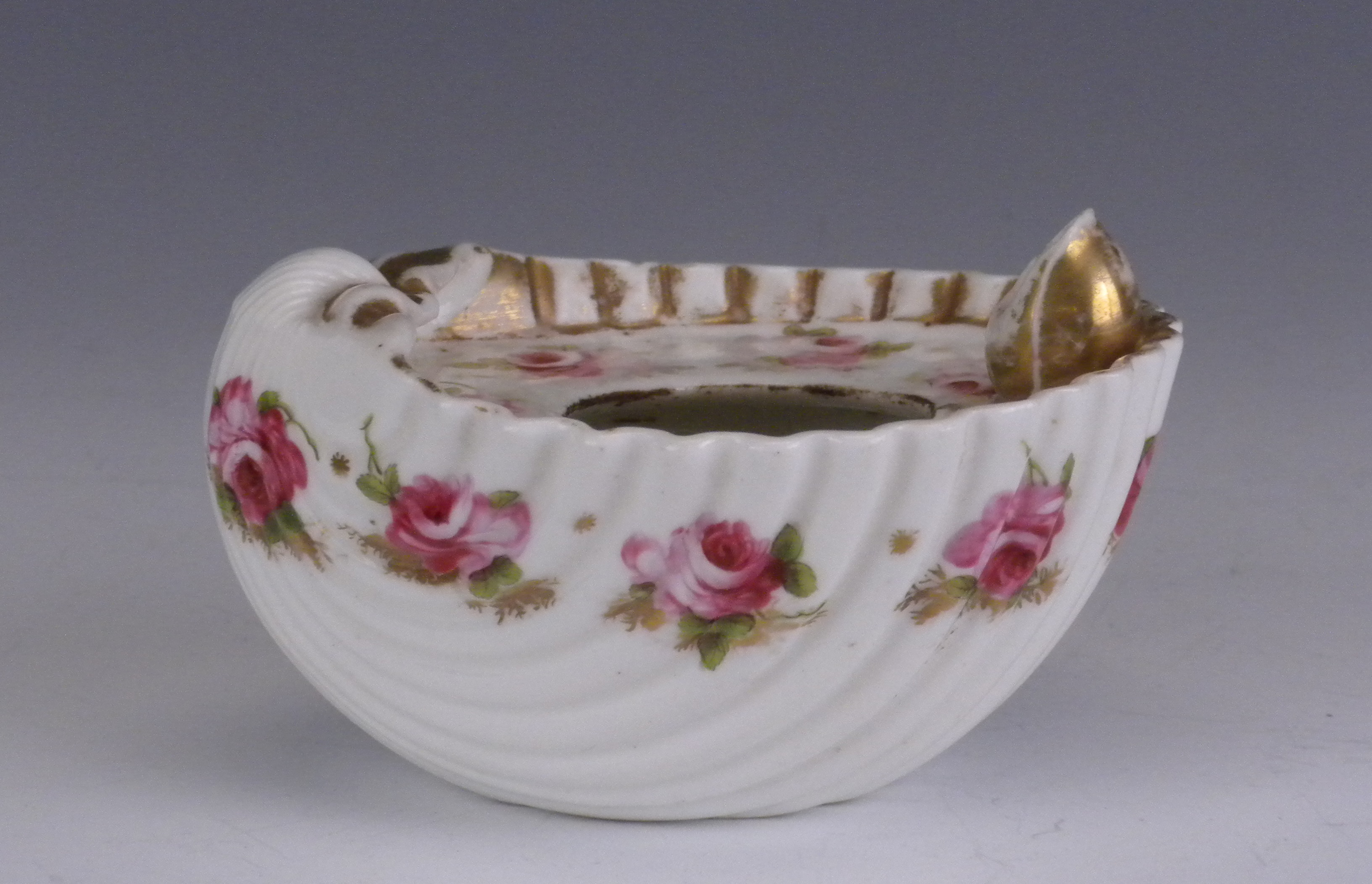 A Swansea porcelain shell Inkwell, circa 1815-1818, locally painted with rose sprigs on gilt seaweed