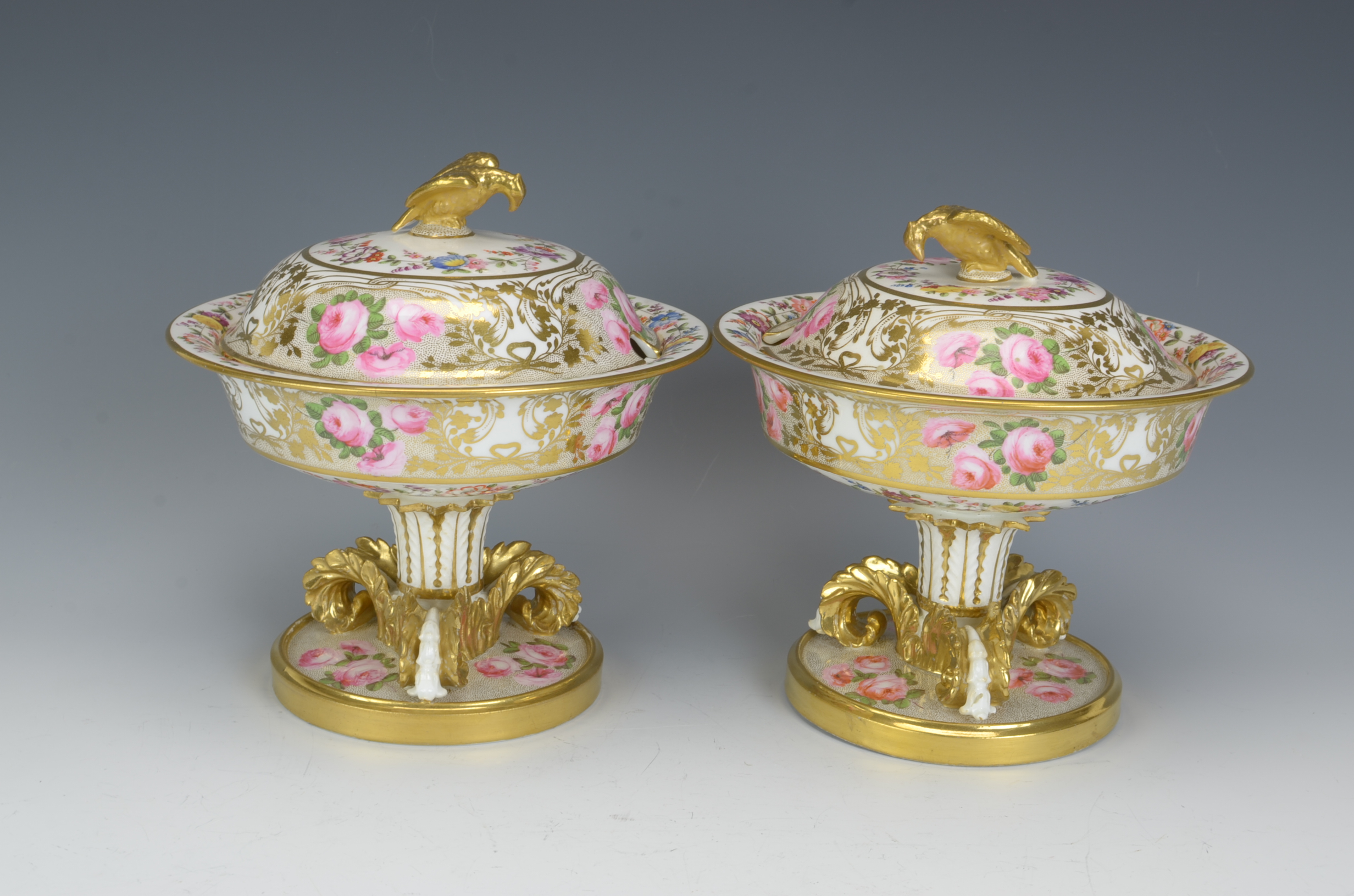 A pair of Coalport lidded Sucriers with pink rose and floral painted decoration, gilt leafage and