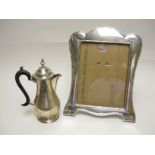 A George V silver baluster Coffee Pot with ebonised handle, London 1916 and a large silver