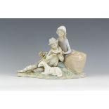 A Lladro Figure of Shepherd and Shepherdess with Lamb, 12in