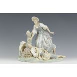A Lladro Figure Group with family and sheep, 11in
