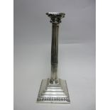 A George III silver Pillar Candlestick with fluted column, ionic capital on stepped square base,